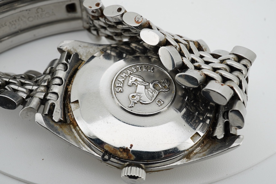 A gentleman's 1964 stainless steel Omega Seamaster Automatic wrist watch, with baton numerals and date aperture, movement 562, case diameter 35mm, on a stainless steel Omega bracelet, with Omega zip up pouch, no papers.